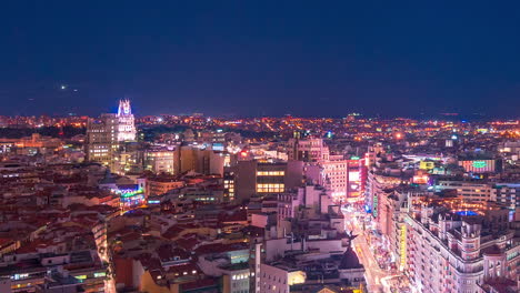 Madrid-Timelapse-at-night,-rooftop-close-up-aerial-view-of-the-Gran-Via