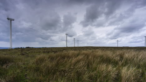 Time-Lapse-of-wind-turbines-with-dramatic-clouds-in-remote-landscape-of-Ireland