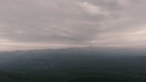 Aerial-dark,-gloomy-landscape,-overcast-sky-before-the-storm-hits-the-mountains