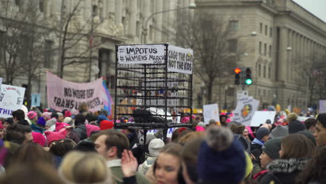 Large-group-of-protesters-with-women's-rights-signs-gathered-on-the-streets-of-Washington-DC-participating-in-the-Women's-March
