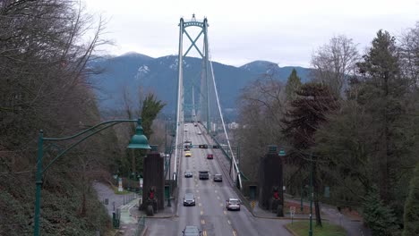Cars-driving-across-Lions-Gate-bridge-in-Vancouver,-BC-on-an-overcast-winter-day