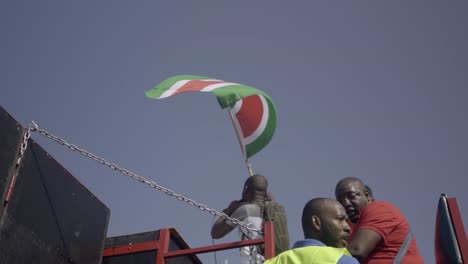 Man-waving-flag-of-Suriname,-slow-motion
