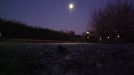 Wide-Angle-of-white-car-braking-and-turning-in-road-during-twilight
