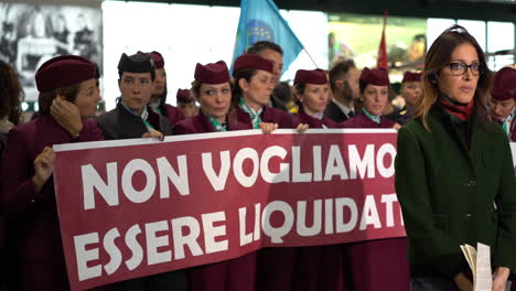 Air-Italy-workers-in-uniform-with-banners-protest-and-reporter