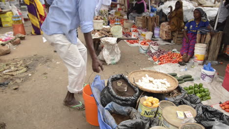 POV-walking-through-a-busy-outdoor-market-in-Moshi,-Tanzania