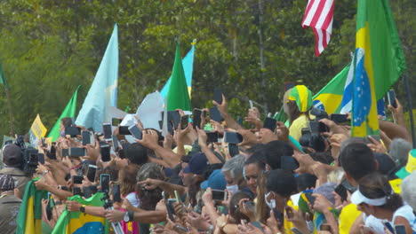 Bolsonaro-Supporters-hold-up-phones-as-President-Bolsonaro-arrives-at-an-anti-lockdown-rally-in-Brasilia