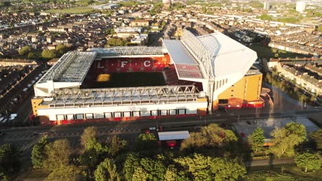 Iconic-Liverpool-Anfield-football-stadium-ground-at-sunrise-aerial-view-high-orbit-left