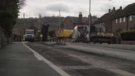 Roadworks-with-heavy-plant-working-on-urban-roads-wide-shot