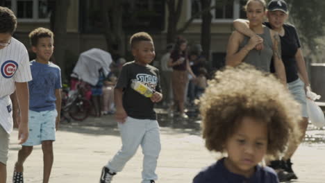 Diverse-Kids-Walking-in-Slow-Mo-at-the-Park,-Downtown-Charleston,-Day