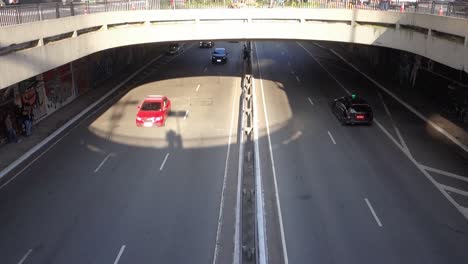 high-angle-view-of-up-and-down-parts-of-a-viaduct-on-Paulista-Avenue,-showing-the-movement-of-people-and-cars