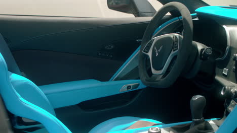 Driver's-seat-and-cockpit-reveal-of-modern-Chevrolet-Corvette,-Close-Up,-Slide-Left