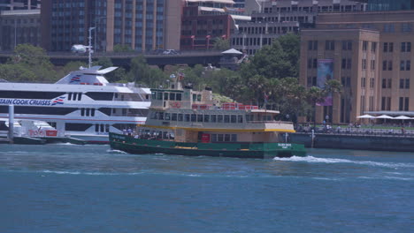 A-Sydney-Ferry-Pulls-into-dock-at-Circular-Quay-on-a-bright-sunny-day-in-Sydney-Australia