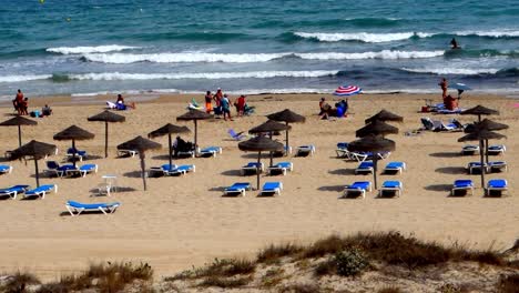 Social-distancing-at-the-beach-in-Mil-Palmeras,-Spain
