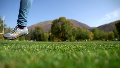 Man-kicking-soccer-ball-in-slow-motion