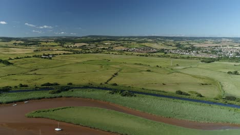 Aerial-of-the-River-exe,-exeter-ship-canal-and-the-village-of-Exminster-in-the-background