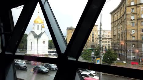 Saint-Nicholas-Chappelle-in-Novosibirsk-city,-Russia,-from-inside-building-view-in-time-lapse-shot-with-hight-traffic-and-people-walking