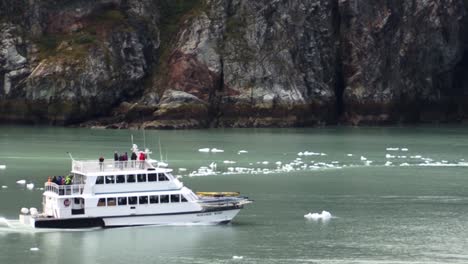 Boat-with-tourists,-visiting-Glacier-Bay-National-Park,-Alaska