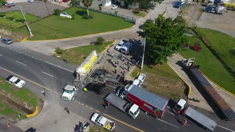 Aerial-view-of-a-truck-and-car-collision-accident,-on-a-highway,-in-Kenya,-Africa---static,-drone-shot
