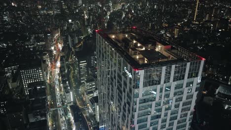 Rooftop-Of-Google-Headquarter-Building-In-Shibuya,-Tokyo-During-Nighttime---high-angle,-hyper-lapse