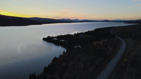 Atlin-Lake-beautiful-sunset,-lakeside-road,-Canada