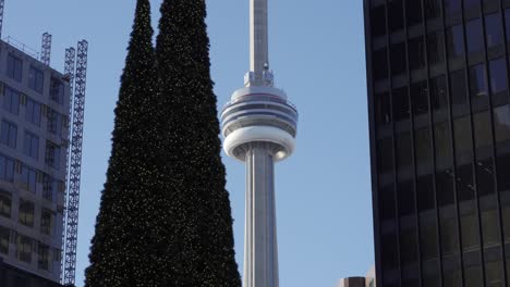 Closeup-Shot-Of-CN-Tower-And-Christmas-Tree-In-Toronto,-Financial-District-Tourist-Destination