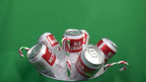 2-2-green-screen-rotating-beer-cans-in-an-ice-bucket-with-hanging-candy-canes-and-a-six-pack-of-old-milwaukee-refreshing-drinks-just-ready-to-burst-out-in-flavor-satisfaction-beyond-taste-perfection