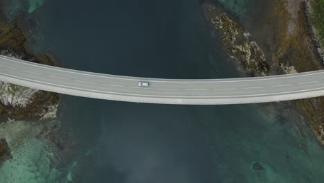 A-single-car-driving-over-a-bridge