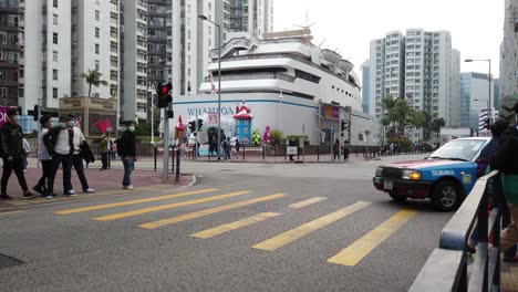People-crossing-the-street-in-Downtown-Hong-Kong-Whampoa-area,-Aerial-view