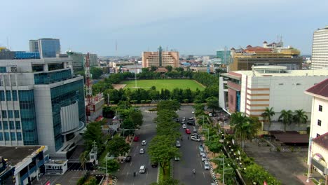 Aerial-view-on-street-in-Semarang-downtown-leading-to-Simpang-Lima,-Indonesia