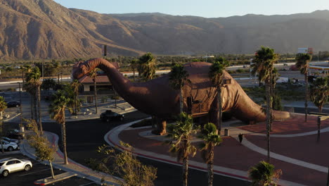 Aerial-view-of-the-Brontosaurus,-one-of-the-Cabazon-Dinosaurs,-World's-Biggest-Dinosaurs,-California