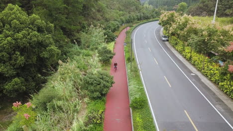 4K-Cyclist-on-Bike-Lane-at-Qiandao-Lake,-Zhejiang-Province,-China