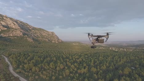 Professional-cinematography-drone-flying-over-vast-Monserrat-mountain-woodland-landscape