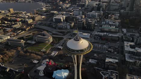High-above-the-Seattle-Center-and-the-iconic-Space-Needle-Tower,-aerial-orbit