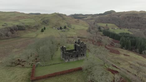 Aerial-view-of-Carnasserie-Castle-ruins-on-an-overcast-day-in-Argyll-and-Bute,-Scotland