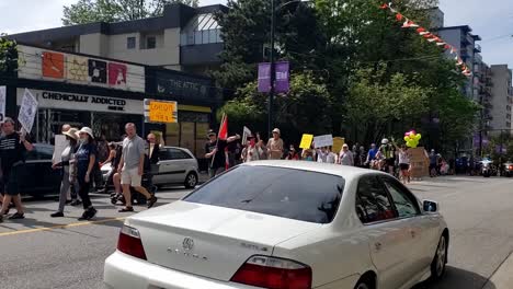 2-3-Antimask-protesters-conspiracy-theorists-march-through-downtown-Vancouver-against-mandatory-mask-policies-lockdowns-potential-COVID-19-vaccines-and-attendees-carried-signs-of-unproven-conspiracies