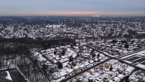 an-aerial-time-lapse-over-a-suburban-neighborhood-after-a-snow-storm
