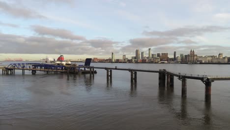 Stena-Line-logistics-ship-terminal-aerial-view-Birkenhead-Liverpool-harbour-city-landscape-slow-rising-shot