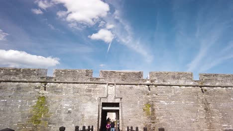 Tilt-Up-of-Castillo-San-Marcos-Fortress-entrance-with-background-people