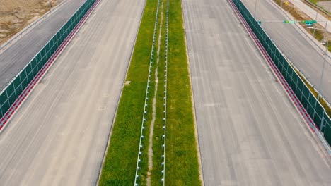 Empty-highway,-no-people,-no-traffic,-Empty-Highway-in-Europe,-drone-shot-off-cars-and-traffic-passing,-countryside