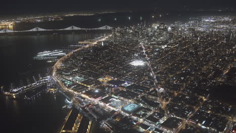 Vista-Aerea-De-Una-Ciudad-En-La-Noche