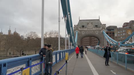 Walking-towards-the-North-end-of-Tower-Bridge-on-a-cloudy-day