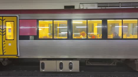 Train-departing-the-station,-queensland-rail-public-transportation,-Brisbane-city,-Australia