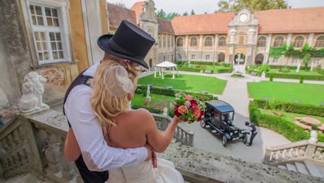 Behind-the-shoulder-shot-of-old-school-fashioned-wedding-couple-embracing-each-other