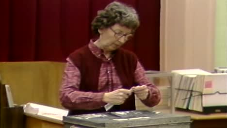 1983-OLD-MAN-RETURNS-BALLOT-TO-VOTER-BOX