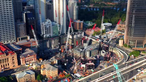 Aerial-View-Of-Industrial-Tower-Cranes-At-Construction-Site-Of-Queen's-Wharf-In-Brisbane-City,-QLD,-Australia