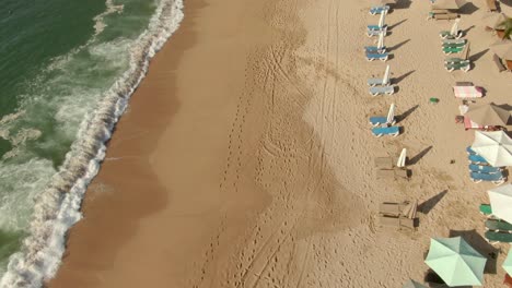 Parasols-At-The-Seashore-With-Crashing-Waves---Yelapa-Beach-In-Jalisco,-Mexico