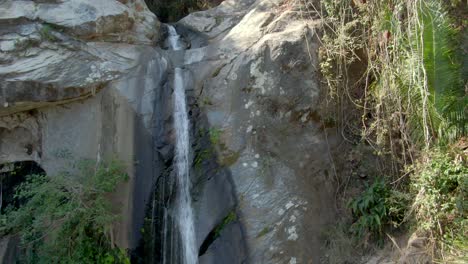 Cascada-de-Yelapa-Flowing-Over-Rocky-Ledge-At-Rainforest-In-Jalisco,-Mexico