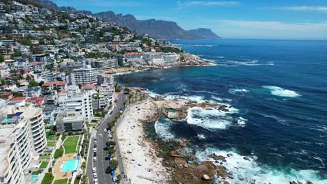coastal-hillside-skyline-of-Sea-Point-in-Cape-Town-South-Africa-on-sunny-summer-day,-aerial