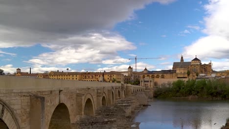 Slow-pan-over-Roman-Bridge-with-river-and-Mezquita-in-distance
