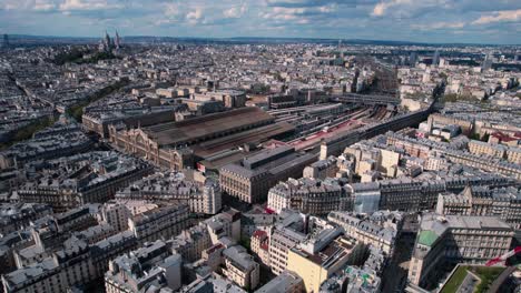 Aerial-view-of-Gare-de-l'Est-railway-station-in-Paris,-France,-circle-pan,-day